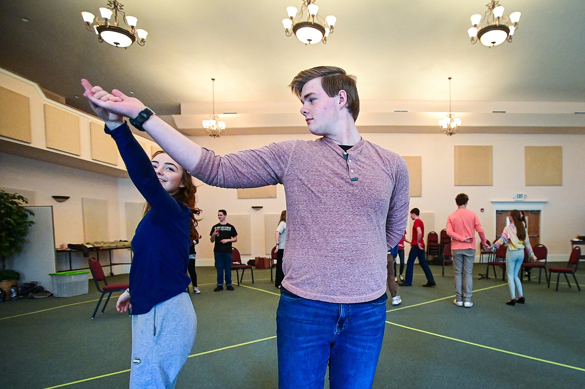 Wyatt Syzmoniak plays Captain Georg von Trapp and Elizabeth Landis plays Maria during the Homeschool Theater Club's rehearsal of "The Sound of Music" at Valley Life Church in Columbia Falls on Friday, March 22. (Casey Kreider/Daily Inter Lake)