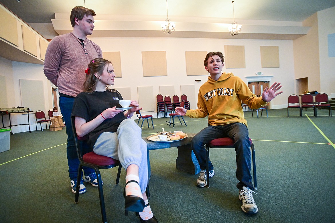 Wyatt Syzmoniak plays Captain Georg von Trapp, Keira Reed plays Baroness Elsa Schrader and Tony Artyomenko plays Max Detweiler during the Homeschool Theater Club's rehearsal of "The Sound of Music" at Valley Life Church in Columbia Falls on Friday, March 22. (Casey Kreider/Daily Inter Lake)