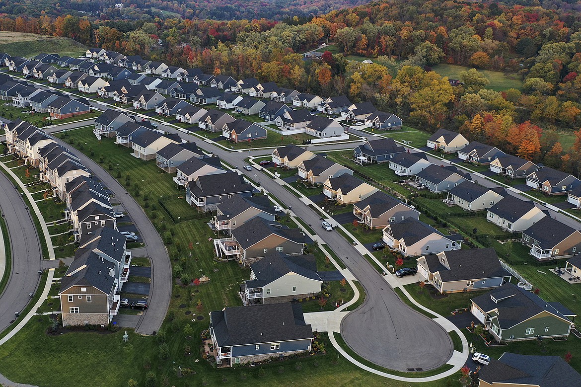 A new housing development is seen from above, Oct. 12, 2022, in Middlesex Township, Pa. Real estate brokerage company Compass Inc. will pay $57.5 million as part of a proposed settlement to resolve lawsuits over real estate commissions, the company said in a regulatory filing Friday, March 22, 2024. (AP Photo/Gene J. Puskar, File)