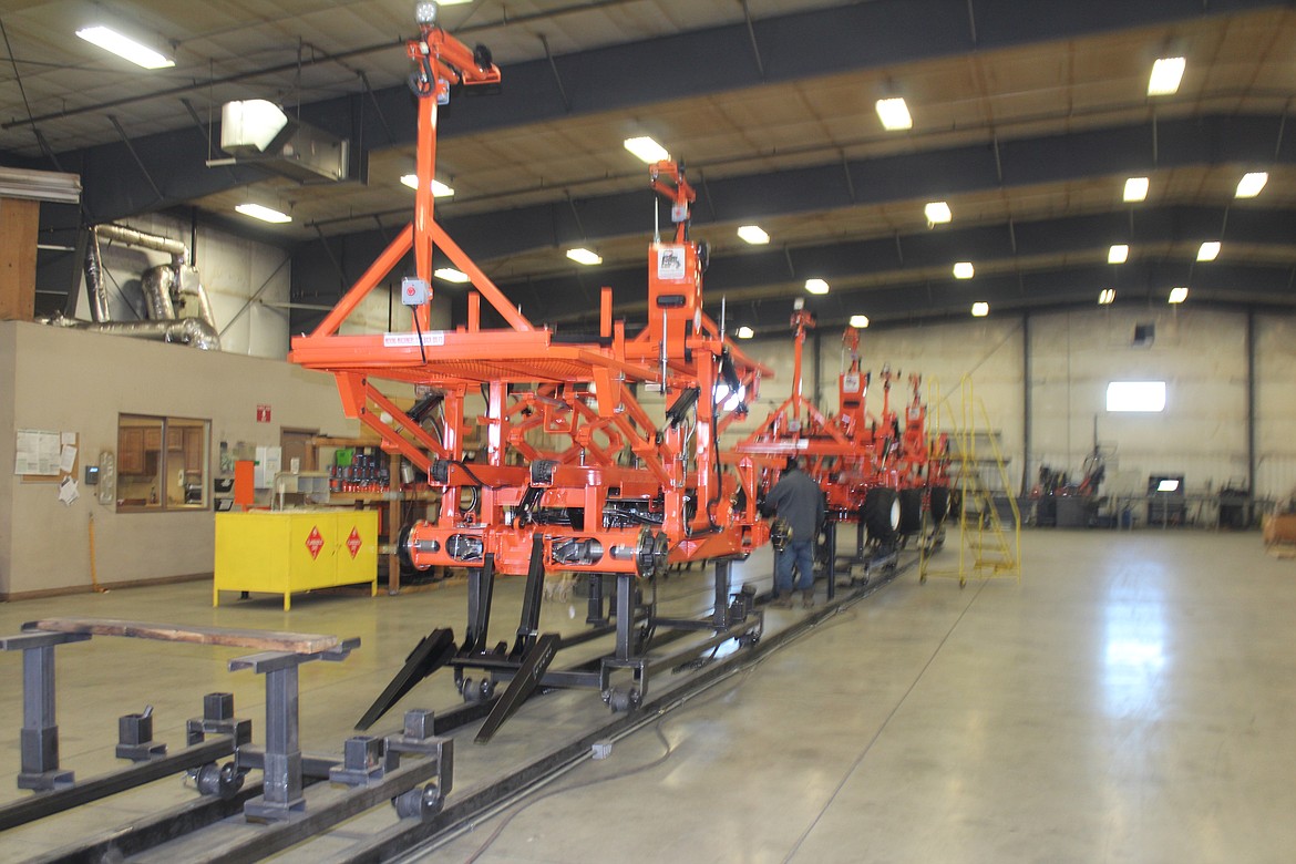 Bandit harvesters sit waiting for assembly at the Automated Ag manufacturing facility in Moses Lake.