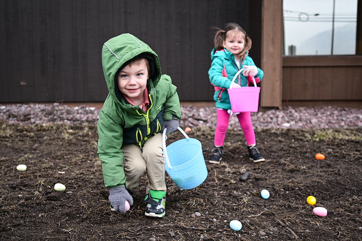 Children pick up eggs during an Inclusive Easter Egg Hunt for kids with low vision, sensory or wheelchair and walker accessibility needs hosted by Healthy Beginnings Pediatric Therapy in Columbia Falls on Saturday, March 23. (Casey Kreider/Daily Inter Lake)