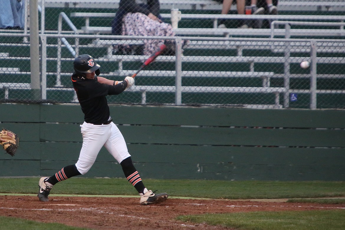 Ephrata senior Cody Black makes contact with an East Valley pitch.