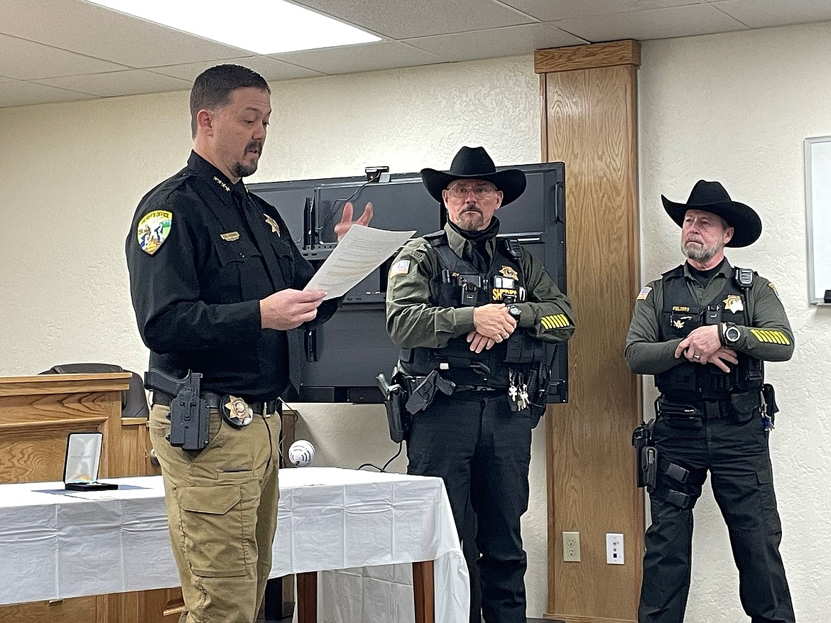 Mineral County Sheriff Ryan Funke with Sanders County Sheriff Shawn Fielders and Sanders County Under Sheriff Jerry Johnson. (April Phillips photo)