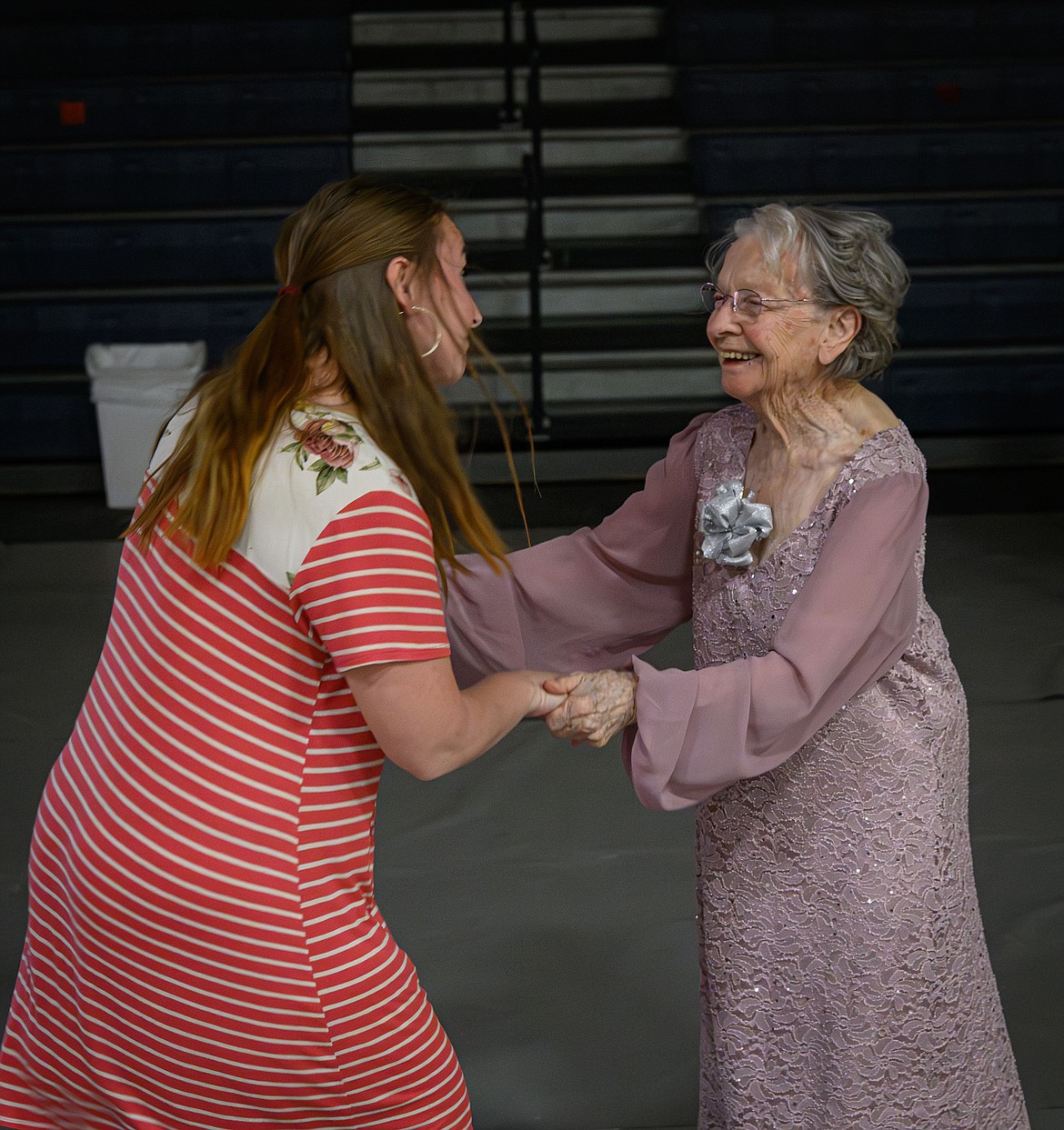Clark Fork Valley Hospital social worker Tasha Steffens encouraging Laura Gee to dance. (Tracy Scott/Valley Press)