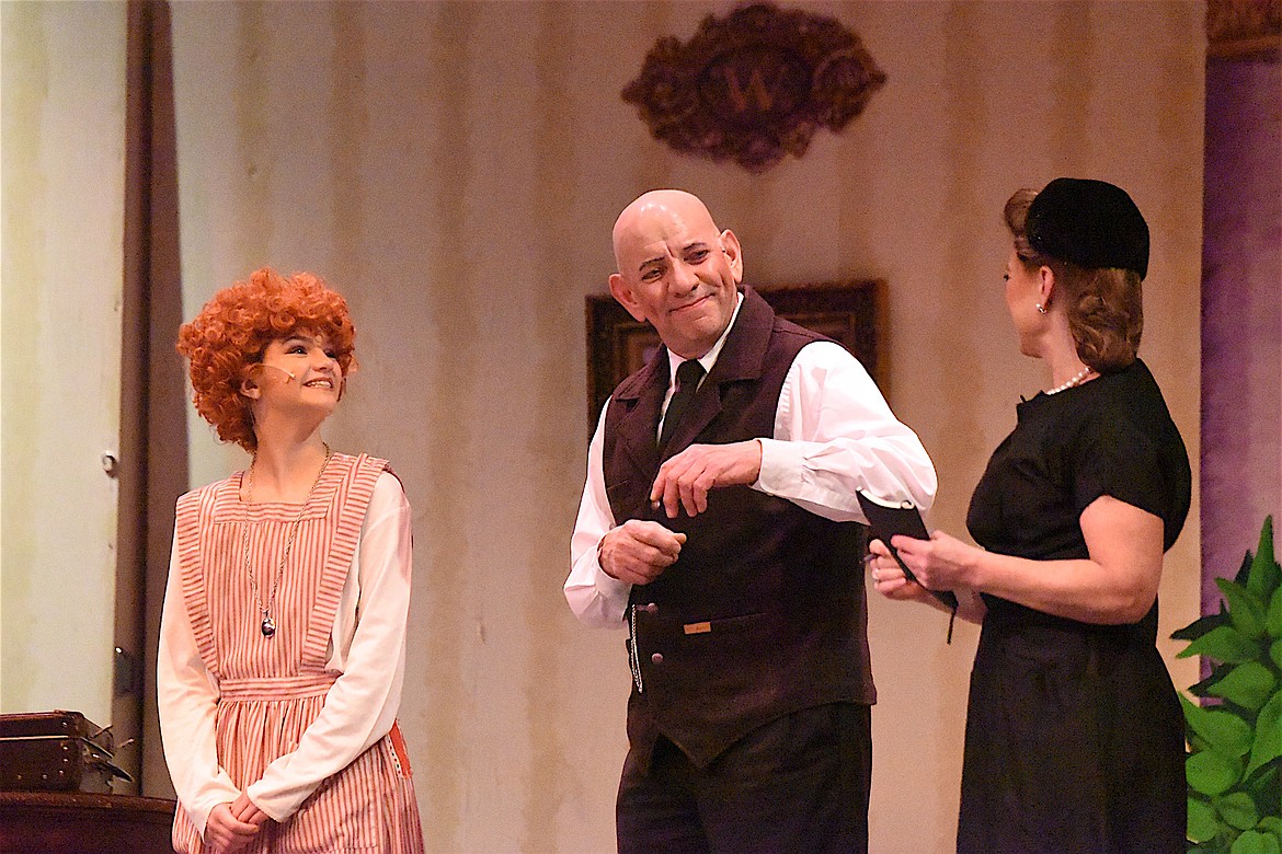 Vivian Cole, Brian Bell and Amy Smart were three of the many who put on the Libby High School-Kootenai Karacters production of Annie last weekend at the Memorial Center in Libby. See the Friday, March 29 edition for more coverage and photos. (Scott Shindledecker/The Western News)