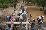 To make water last year-round, Kenyans in dry regions are building sand dams on seasonal rivers