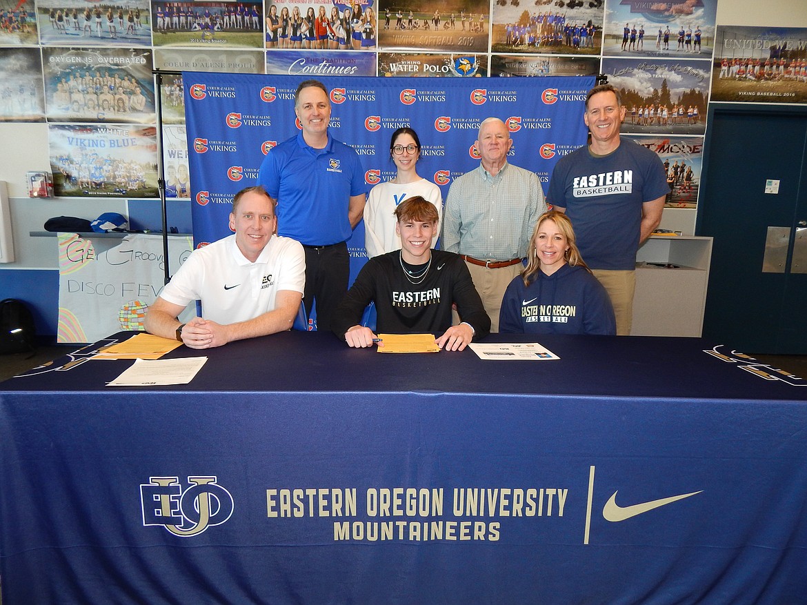 Courtesy photo
Coeur d'Alene High senior Logan Orchard recently signed a letter of intent to play basketball at NAIA Eastern Oregon University in La Grande, Ore. Seated from left are Chris Kemp, Eastern Oregon University men's basketball coach; Logan Orchard, and Becky Orchard (mom); and standing from left, Jon Adams, Coeur d'Alene High boys basketball coach; Victoria Beecher, Coeur d'Alene High athletic director, Col. R.W. Schumacher (grandpa; retired Marine Corps), and Keith Orchard (dad).