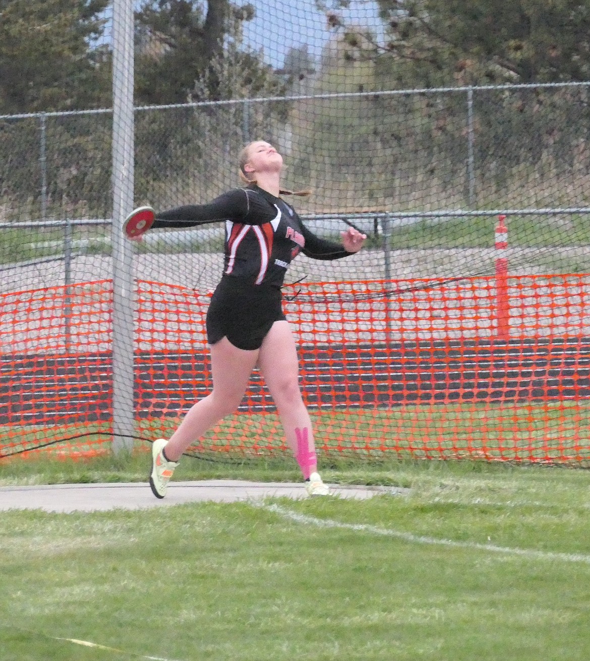 Returning state B-C Discus champion Alexis Demming, show during last season's District meet, is back to defend her title this year as a junior for the Plains Trotters.  She will also be a favorite among B-C shot putters this season. (Chuck Bandel/VP-MI)