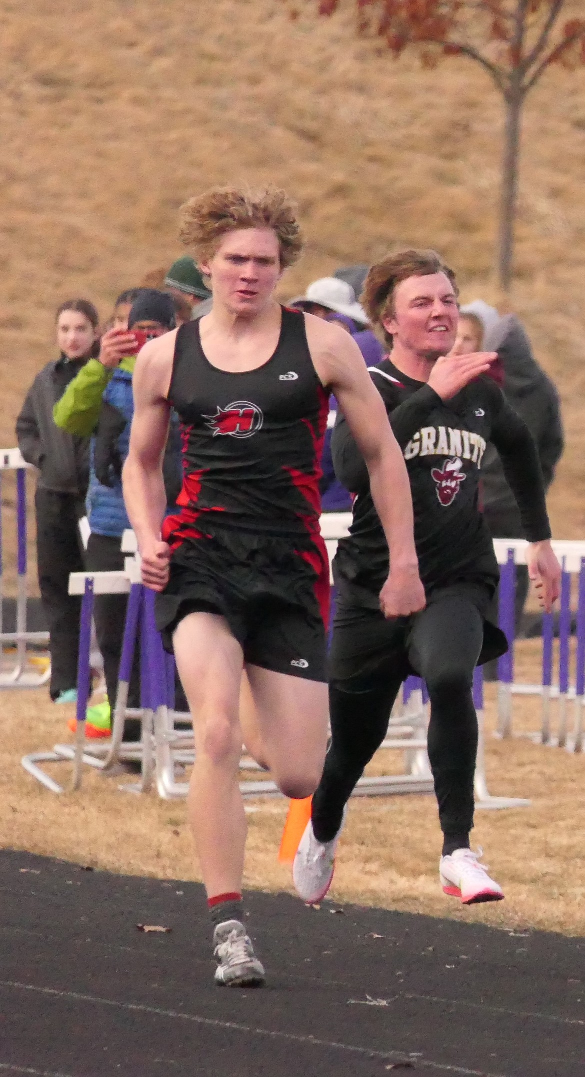 Hot Springs junior Dave Chapman runs the hurdles at last year's 14C District track and field championship meet in Missoula. (Chuck Bandel/VP-MI)