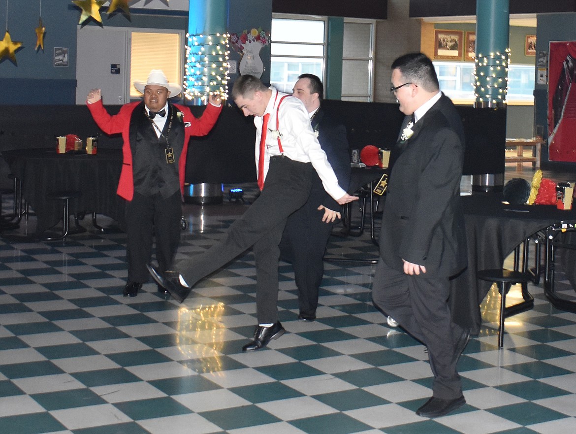 From left: Erick Ocampo, Danny Thurman, Adam "Nick" Burns (partially hidden) and R.J. Melendrez enjoy music and dancing at the PALS Club prom Friday.