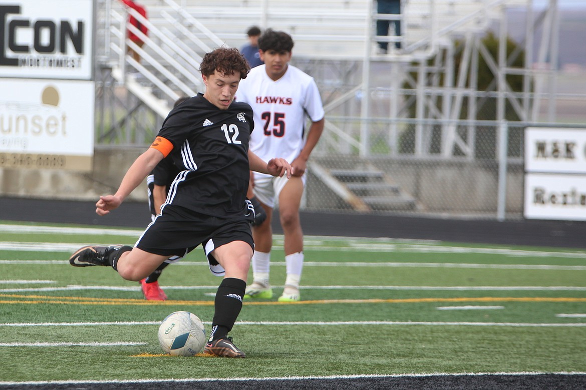 Royal senior Santiago Gonzalez (12) scores on a penalty kick in the first half against College Place Saturday.