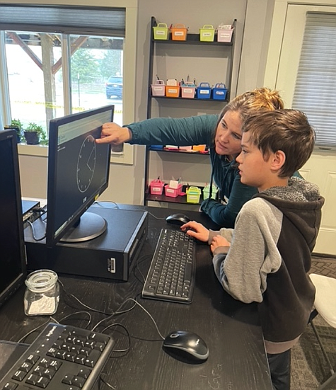 Learning coach Lindsey Entel works with student Joshua Sandberg in a cognitive therapy class at Wired2Learn Academy in Post Falls. The independent school that serves children with learning disabilities officially became an Idaho nonprofit in October, but is now waiting for pending documentation to go through at the federal level.
