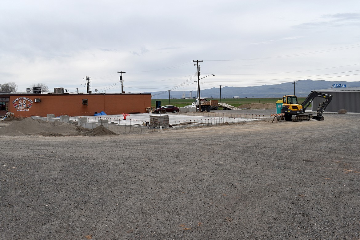 The concrete floor for the Royal City Public Library building has been poured and underground plumbing and floor heat installed. The walls will begin to go up in a month or two, organizers said.