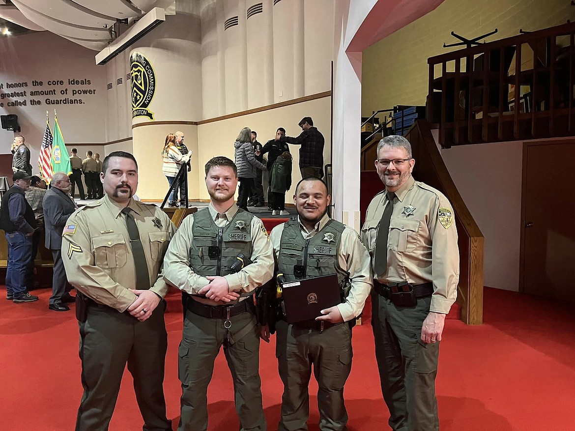 Adams County Sheriff’s Office Deputies Kolby Snyder, left, and Jose Barroso, shown here with colleagues from the ACSO, graduated March 20 from the Washington State Corrections Academy.