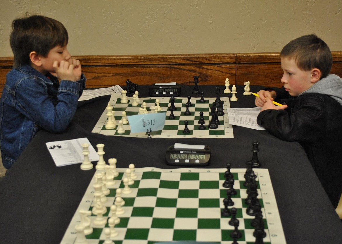 Leo Grace and Logan Davis compete in an Idaho chess tournament in March.