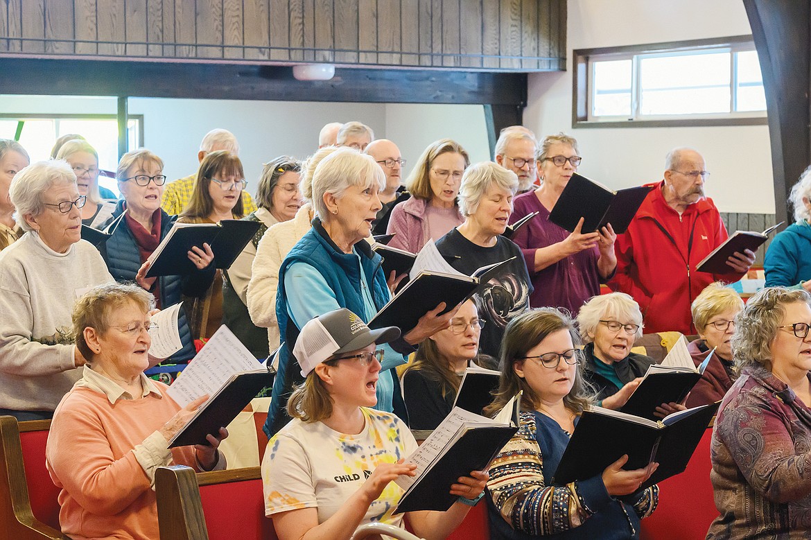 The Columbia falls Community Choir practices Sunday for its upcoming concert in April. (Chris Peterson photo)