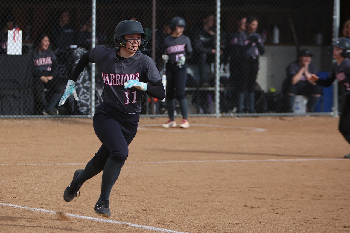 ACH freshman Josie Bayless runs to first base after recording a hit against Wellpinit.