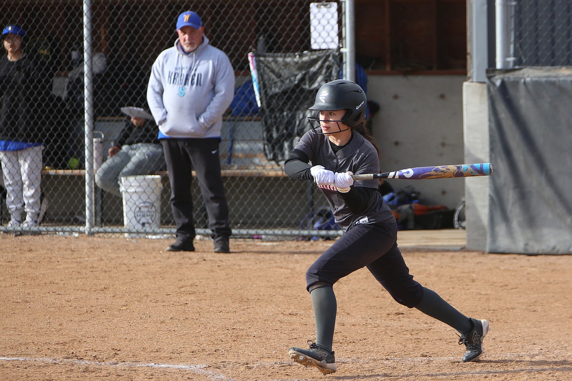 ACH senior Beth Okamoto swings the bat against Wellpinit. The ACH Warriors brought home two wins on their scorecard at the away double-header against Wellpinit.