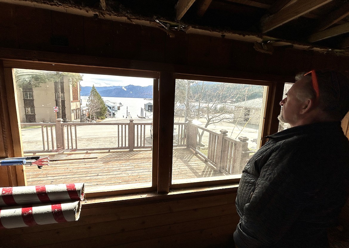 Dave Adlard on Wednesday looks out the window of the closed Buttonhook Inn that he plans to renovated and open this year in Bayview.