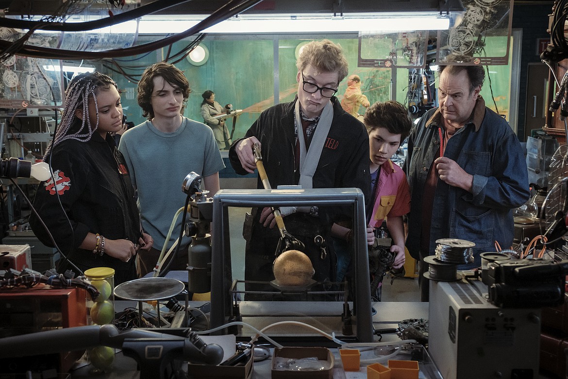 This image released by Columbia Pictures shows, from left, Celeste O'Connor, Finn Wolfhard, James Acaster, Logan Kim and Dan Aykroyd in a scene from "Ghostbusters: Frozen Empire."