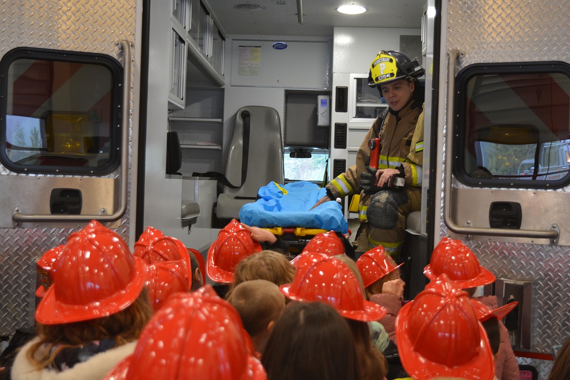 Cooper Welk shows the kindergarteners the inside of one of the Silver Valley ambulances.