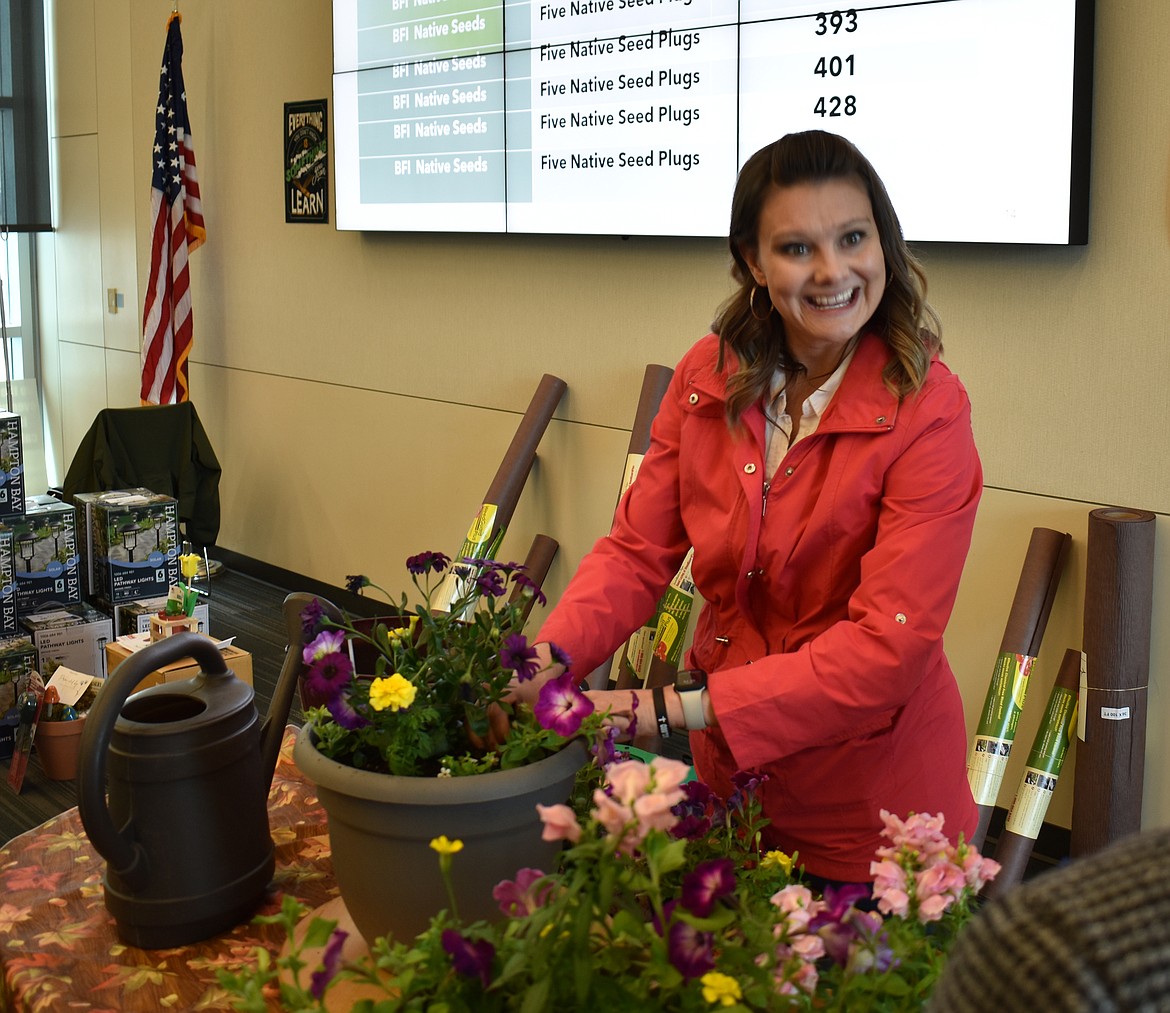 Master Gardener Bonnie Bodenman demonstrates planting techniques at the 2023 Eco-Gardening Symposium.