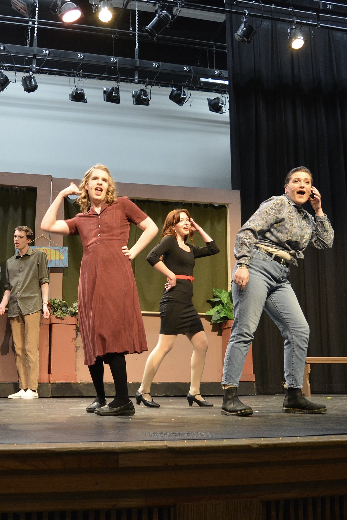 Lake City High School students dance and sing to the title number of "Little Shop of Horrors" to warm up before a performance. From left, Tyson Karlinsey, Jadzia McConnell, Juno Otis and Rebekah Selby.