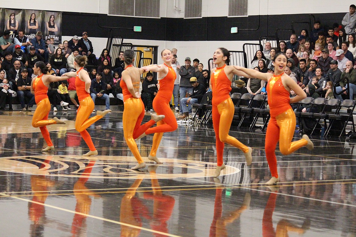 The Royal High School dance team performs during a February basketball game. The Knights successfully defended their title in the 1A/2A military competition at the state championships March 23.