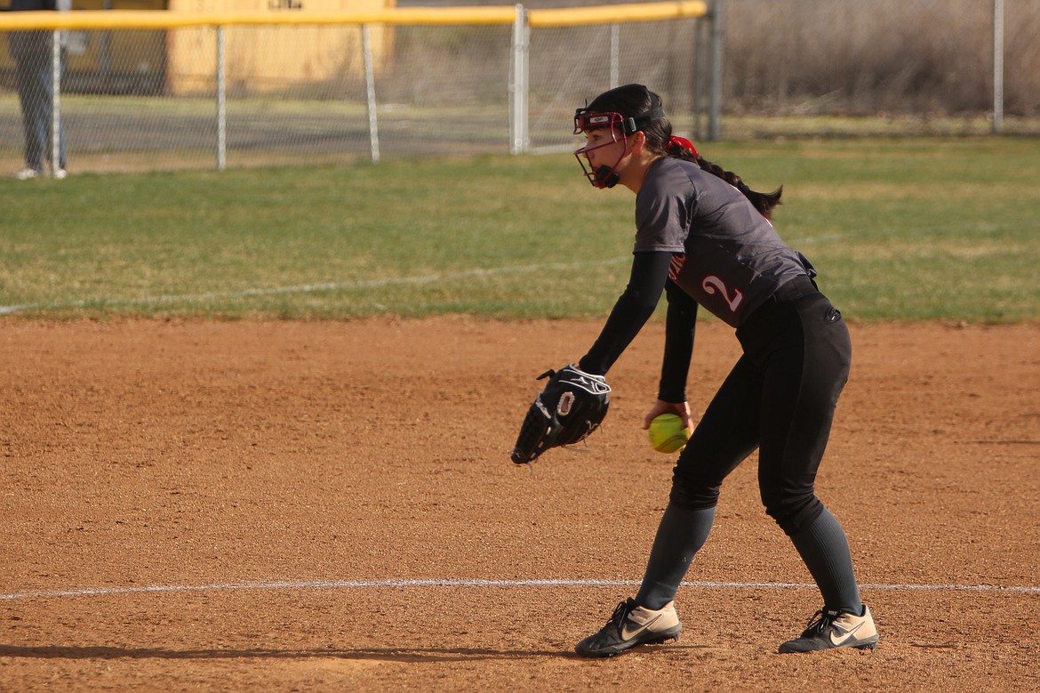 ACH freshman Grace Okamoto prepares to pitch against Wellpinit during the Warrior’s softball doubleheader on Tuesday.