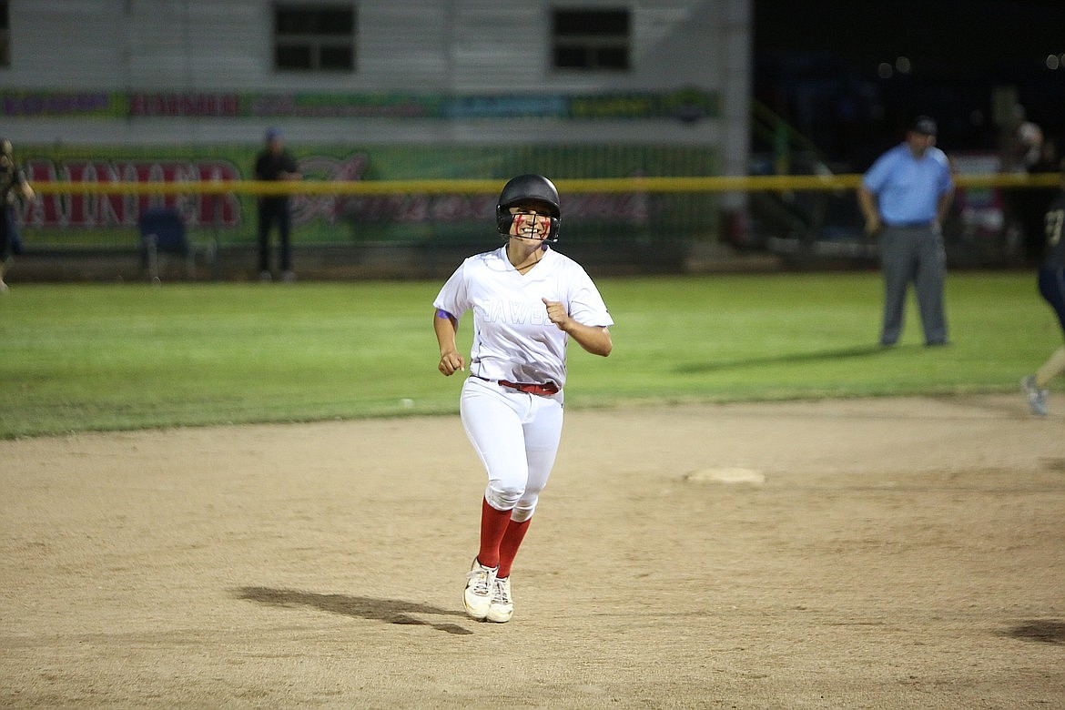 Othello senior Persayis Garza smiles while rounding the bases after hitting a home run last season. Garza hit her fifth home run of the season Wednesday against Wenatchee.