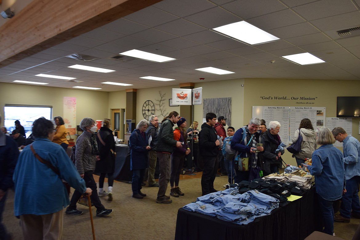 Sandhill Crane Festival attendees visit informational booths and purchase merchandise at Othello Church of the Nazarene during the festival activities March 23. Festival Co-Chair Kurt Braunwart said this year’s event had one of the largest attendances yet.