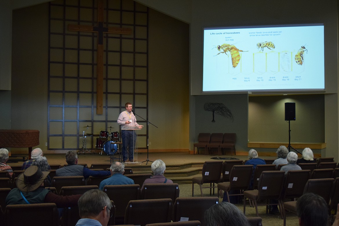 A speaker from the Washington State University Honey Bees and Pollinators program lectures in the sanctuary at Othello Church of the Nazarene, one of the venues for the 2024 Othello Sandhill Crane Festival.