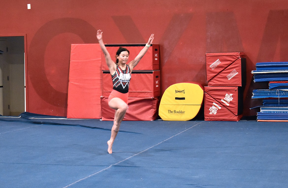 Clara Knapp prepares to do a flip in warmups at AIM Gymnastics Thursday. Clara is one of five AIM gymnasts to qualify for the regional competition later this month.