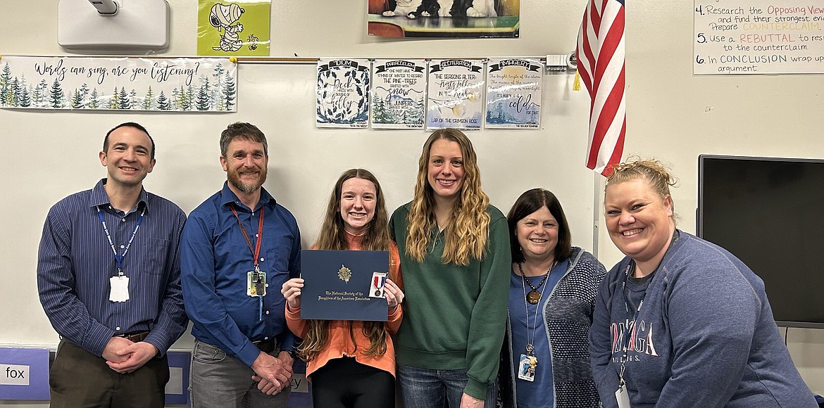 River City Middle School's Faith Harmon is the eighth grade winner of the Pleasantview Chapter of the Daughters of the American Revolution's American History Essay Contest. From left: Andy Preiss, Mark Harmon, Faith Harmon, Staci Harmon, Nancy Hicks and Janey Ortega.