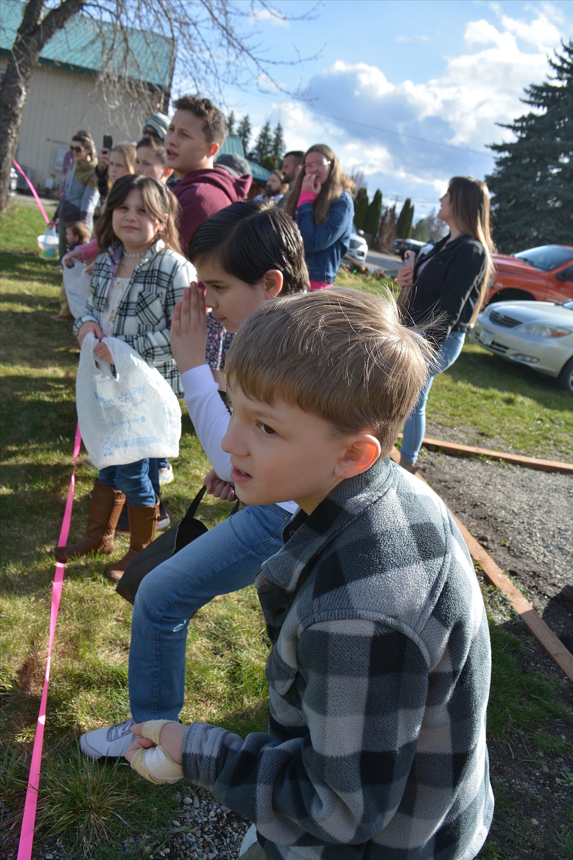 Maddox McClain didn't let an injury on his hand slow him down as he sped around the lawn to collect Easter eggs.