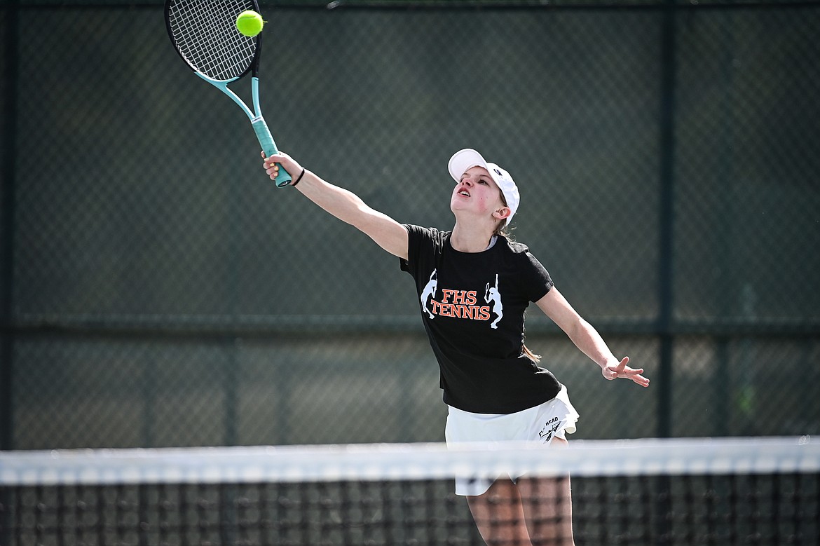 Flathead's Sarah Loran hits a return in a girls singles match against Helena's Qayl Kujala at FVCC on Saturday, March 30. (Casey Kreider/Daily Inter Lake)