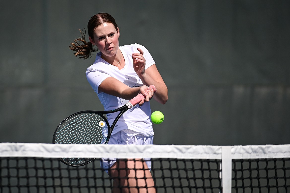 Glacier's Sarah Downs hits a return in a girls singles match against Helena Capital's Julia Kings at FVCC on Saturday, March 30. (Casey Kreider/Daily Inter Lake)