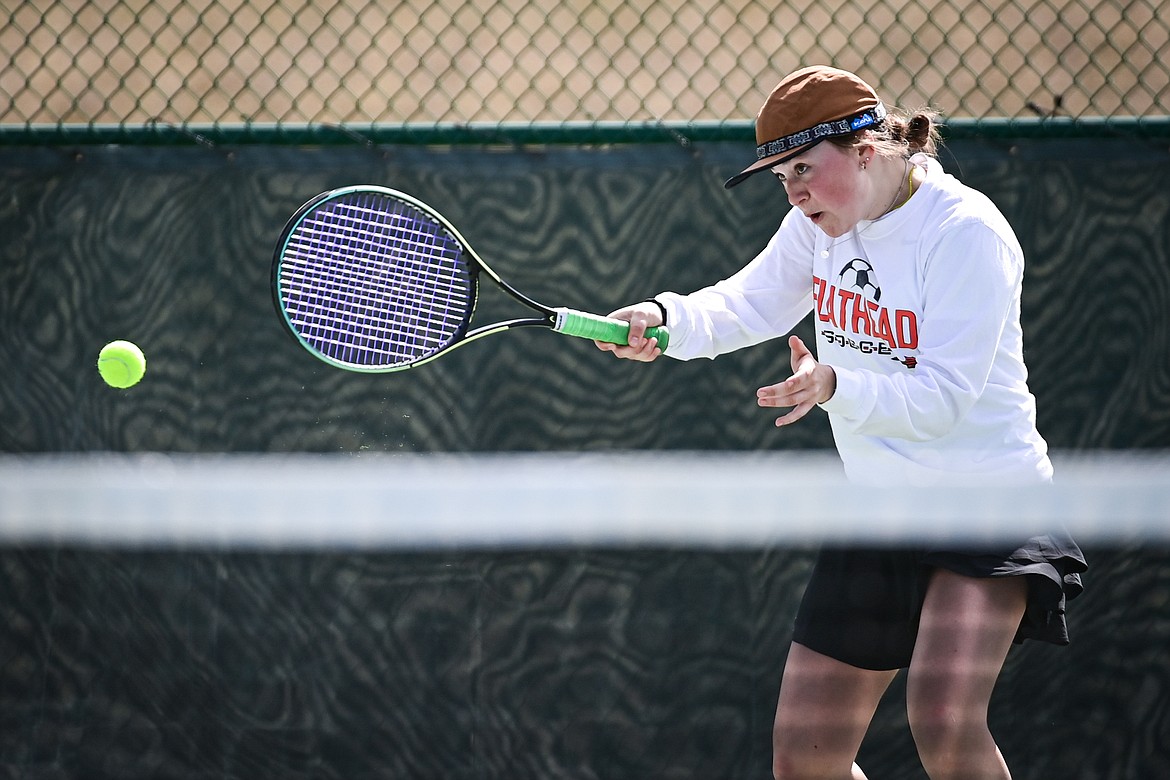 Flathead's Azalea Bailey hits a return in a girls singles match against Helena's Nelly Clevenger at FVCC on Saturday, March 30. (Casey Kreider/Daily Inter Lake)