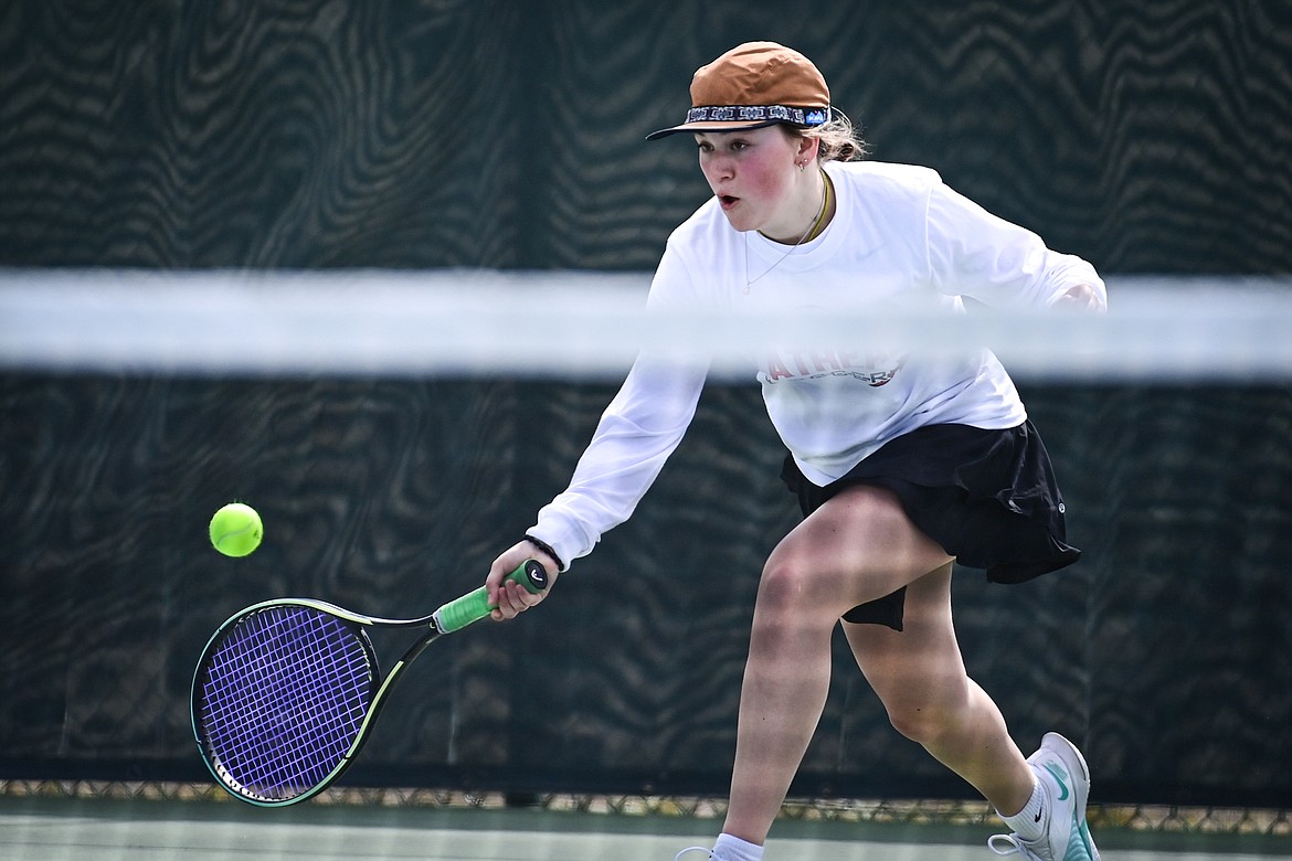 Flathead's Azalea Bailey hits a return in a girls singles match against Helena's Nelly Clevenger at FVCC on Saturday, March 30. (Casey Kreider/Daily Inter Lake)