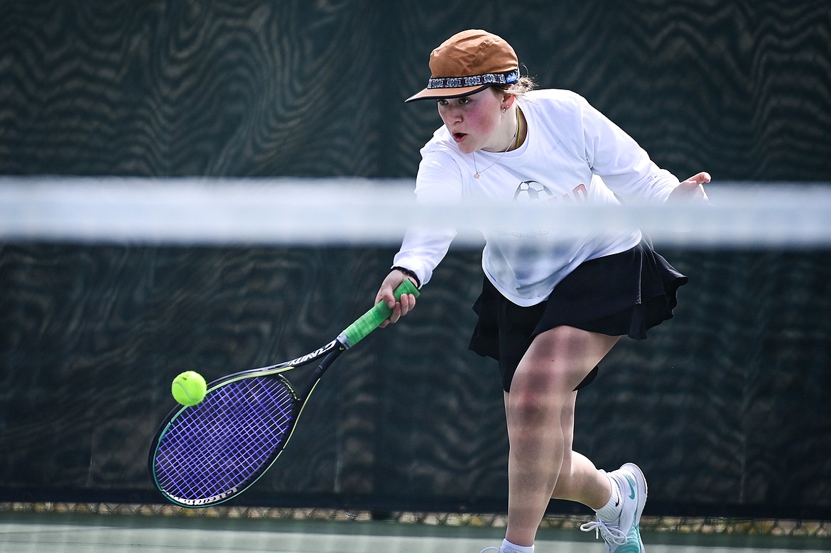 Flathead's Azalea Bailey hits a return in a girls singles match against Helena's Nelly Clevenger at FVCC on Saturday, March 30. (Casey Kreider/Daily Inter Lake)