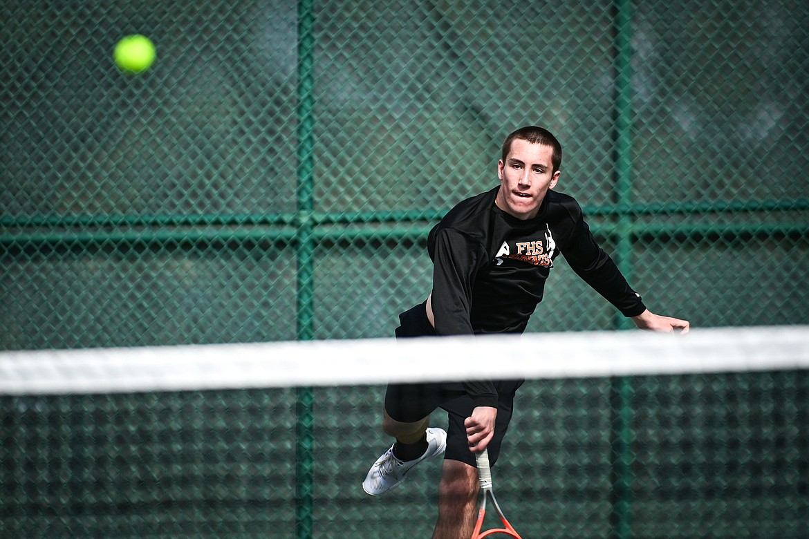 Flathead's Holden Askvig serves in a boys singles match against Helena's Rhys Anderson-Foster at FVCC on Saturday, March 30. (Casey Kreider/Daily Inter Lake)