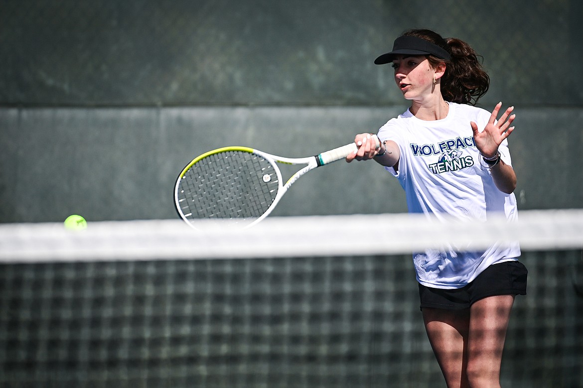 Glacier's Leilani Lennarz hits a return in a girls singles match against Helena Capital's Zoie Jorgensen at FVCC on Saturday, March 30. (Casey Kreider/Daily Inter Lake)