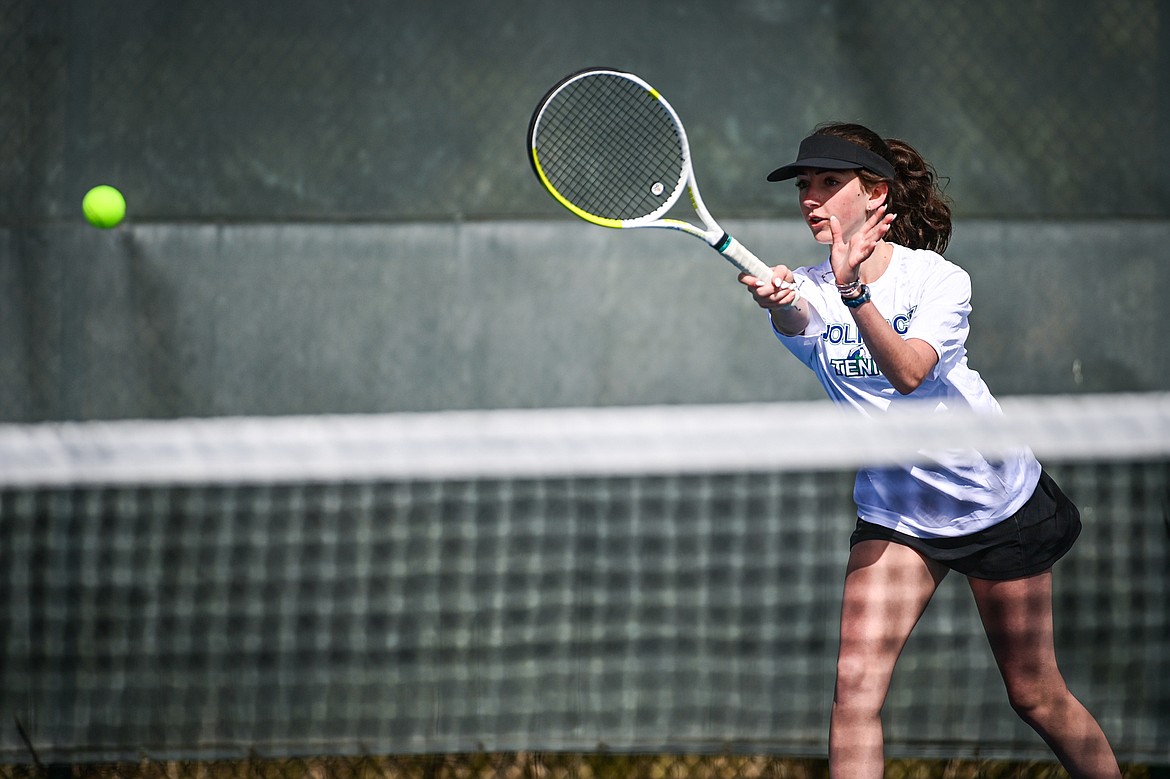 Glacier's Leilani Lennarz hits a return in a girls singles match against Helena Capital's Zoie Jorgensen at FVCC on Saturday, March 30. (Casey Kreider/Daily Inter Lake)