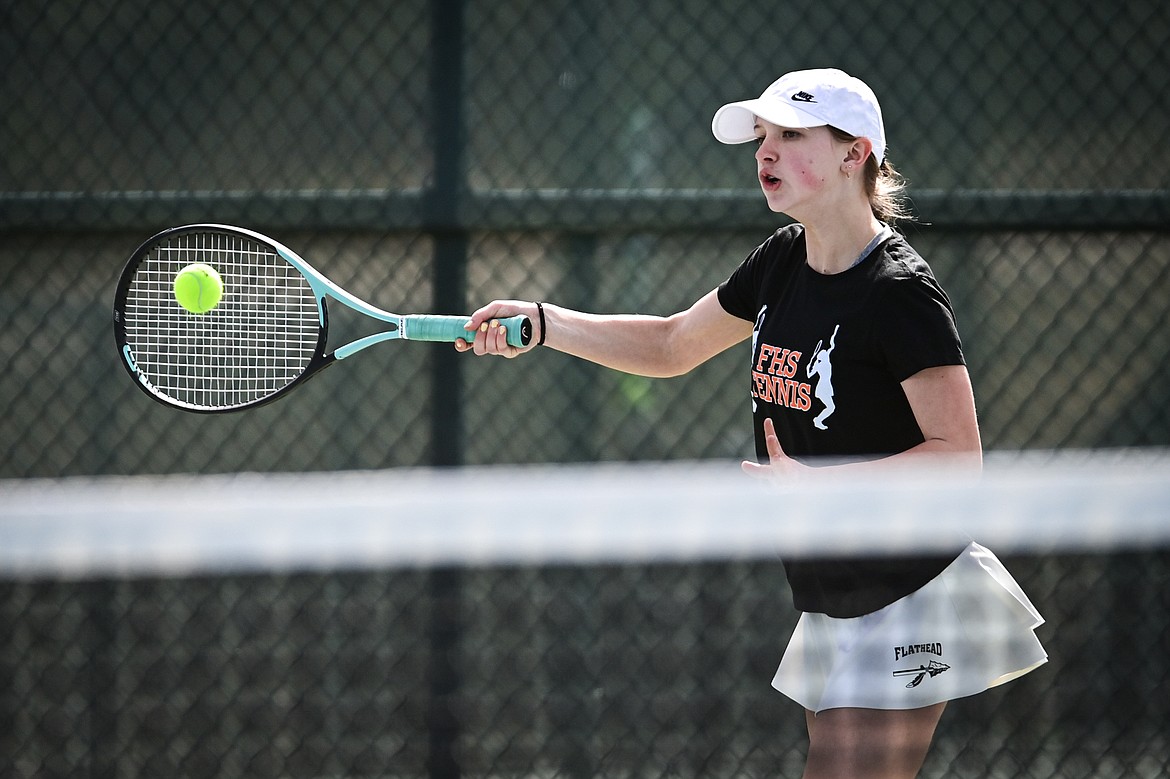 Flathead's Sarah Loran hits a return in a girls singles match against Helena's Qayl Kujala at FVCC on Saturday, March 30. (Casey Kreider/Daily Inter Lake)