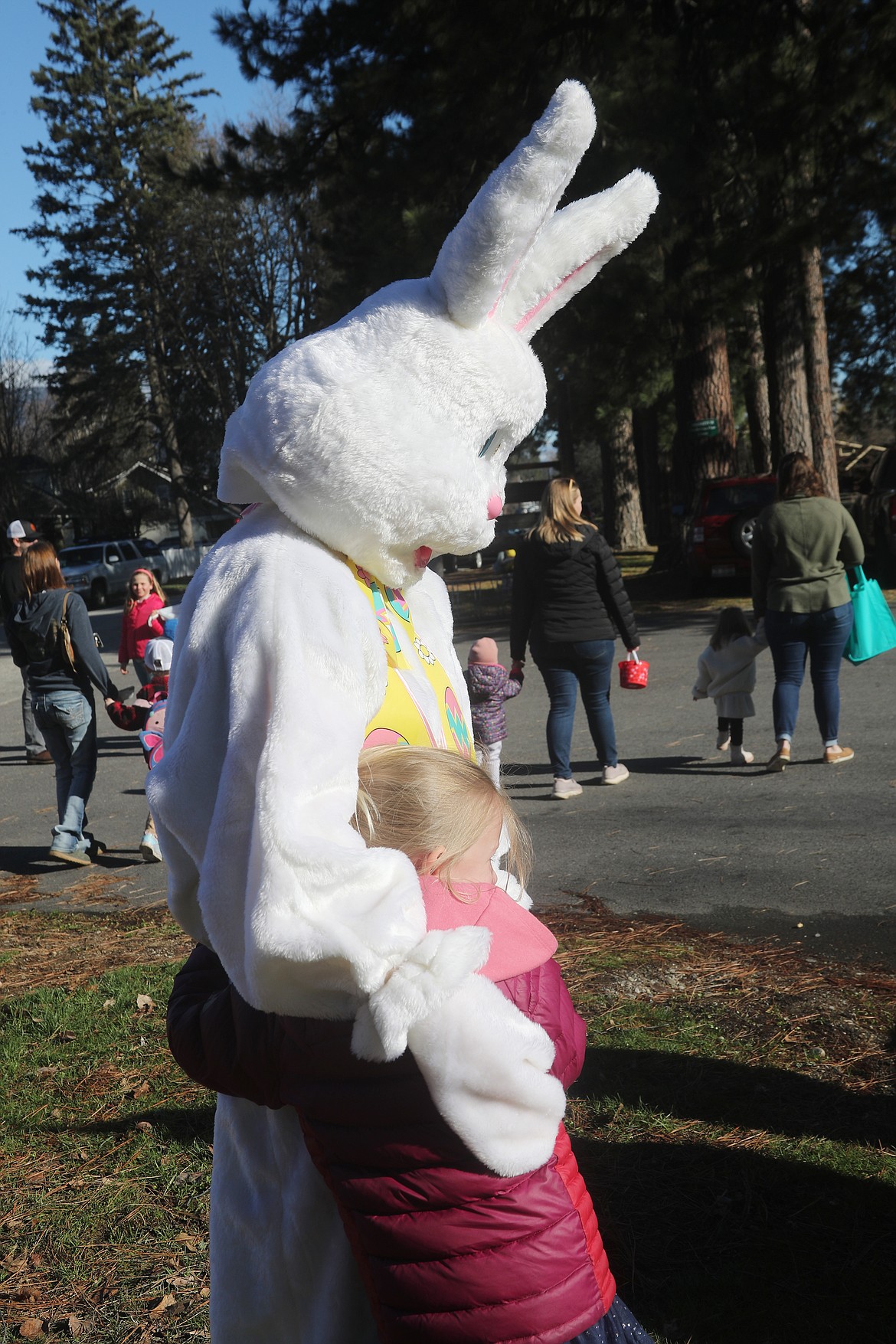 The Easter Bunny gets a hug from a young fan at the Sandpoint Lions' community Easter egg hunt on Saturday.