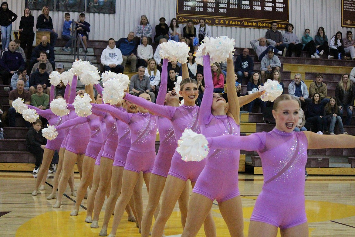 The Moses Lake High School Molahiettes perform their pom routine during the regional round of state basketball games at the MLHS gym in February. The Molahiettes successfully defended their military title at the state tournament.