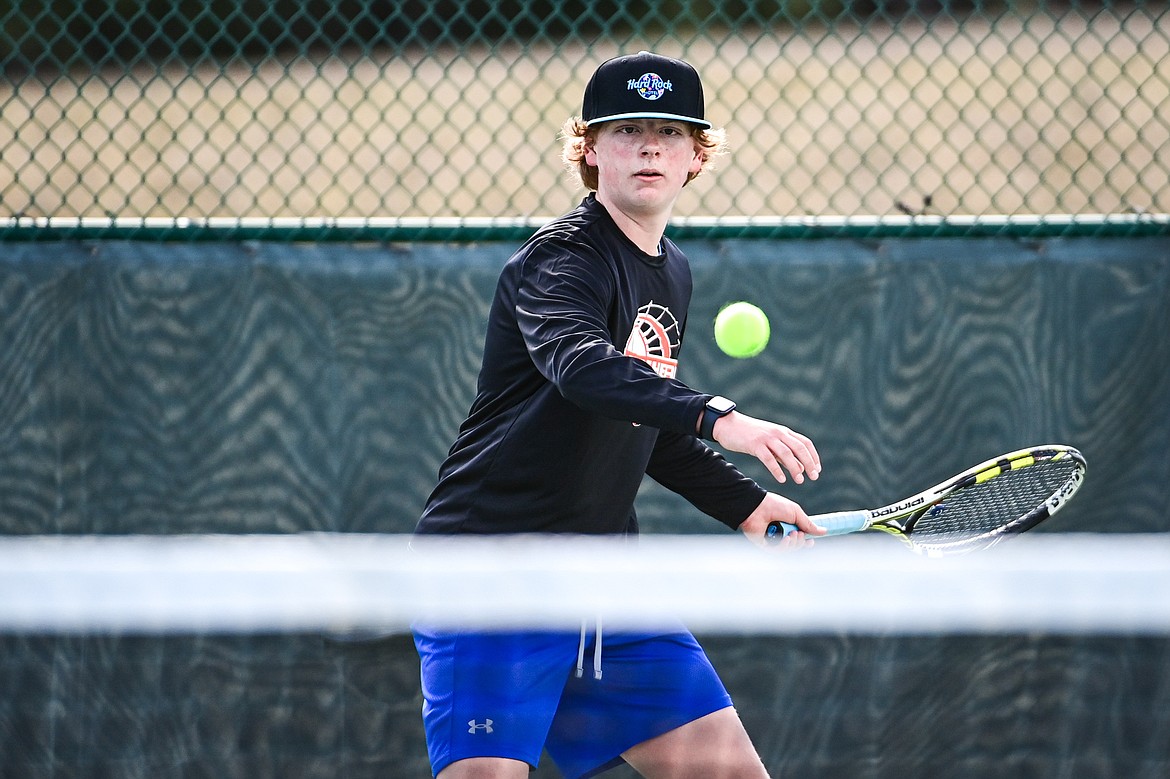 Flathead's Rowan Alexander hits a return in a boys singles match against Helena's Elias Cook at FVCC on Saturday, March 30. (Casey Kreider/Daily Inter Lake)