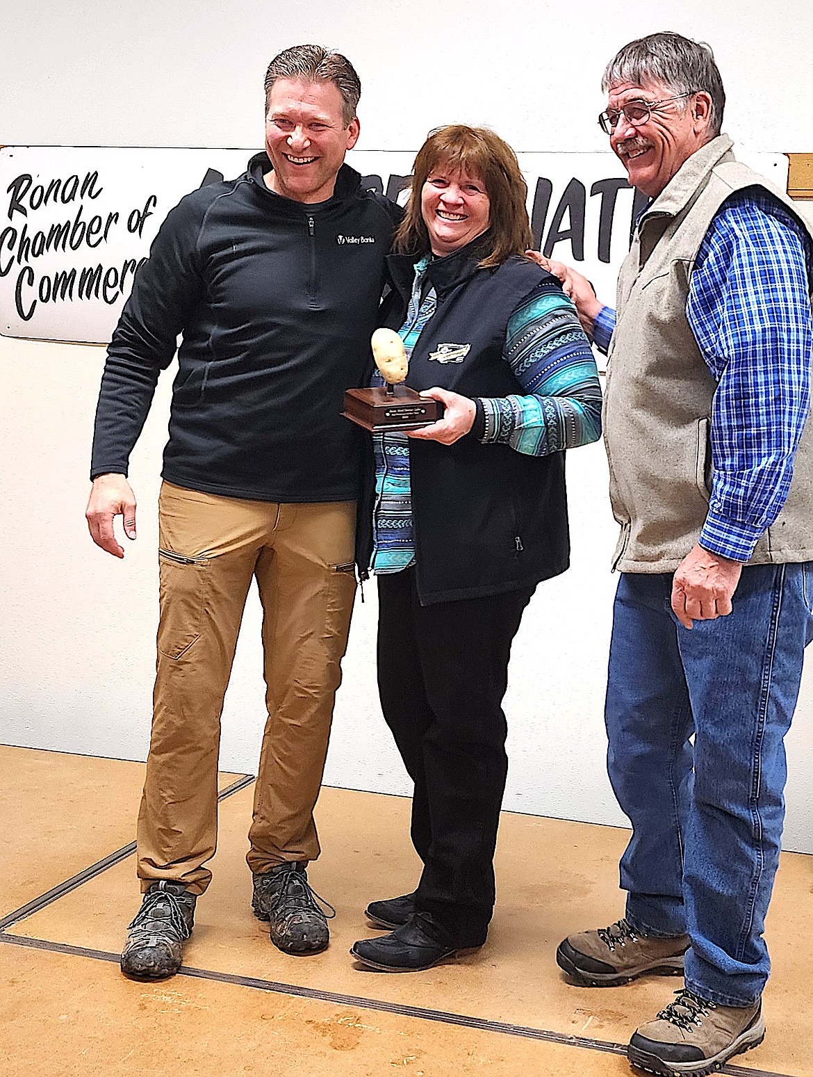 Jamie Buhr, Ronan Chamber of Commerce committee members, stands with Susan and Jack Lake, lifetime Montana farmers, who were honored at the Ag Appreciation event on March 29 at the community center. (Berl Tiskus/Leader)