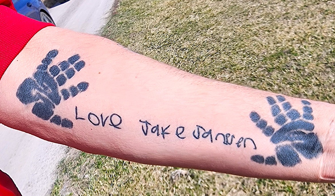 Jake Jannsen's childhood handprints and a loving note are memories Rich Jannsen, Jake's dad, keeps on his arm. (Berl Tiskus/Leader)