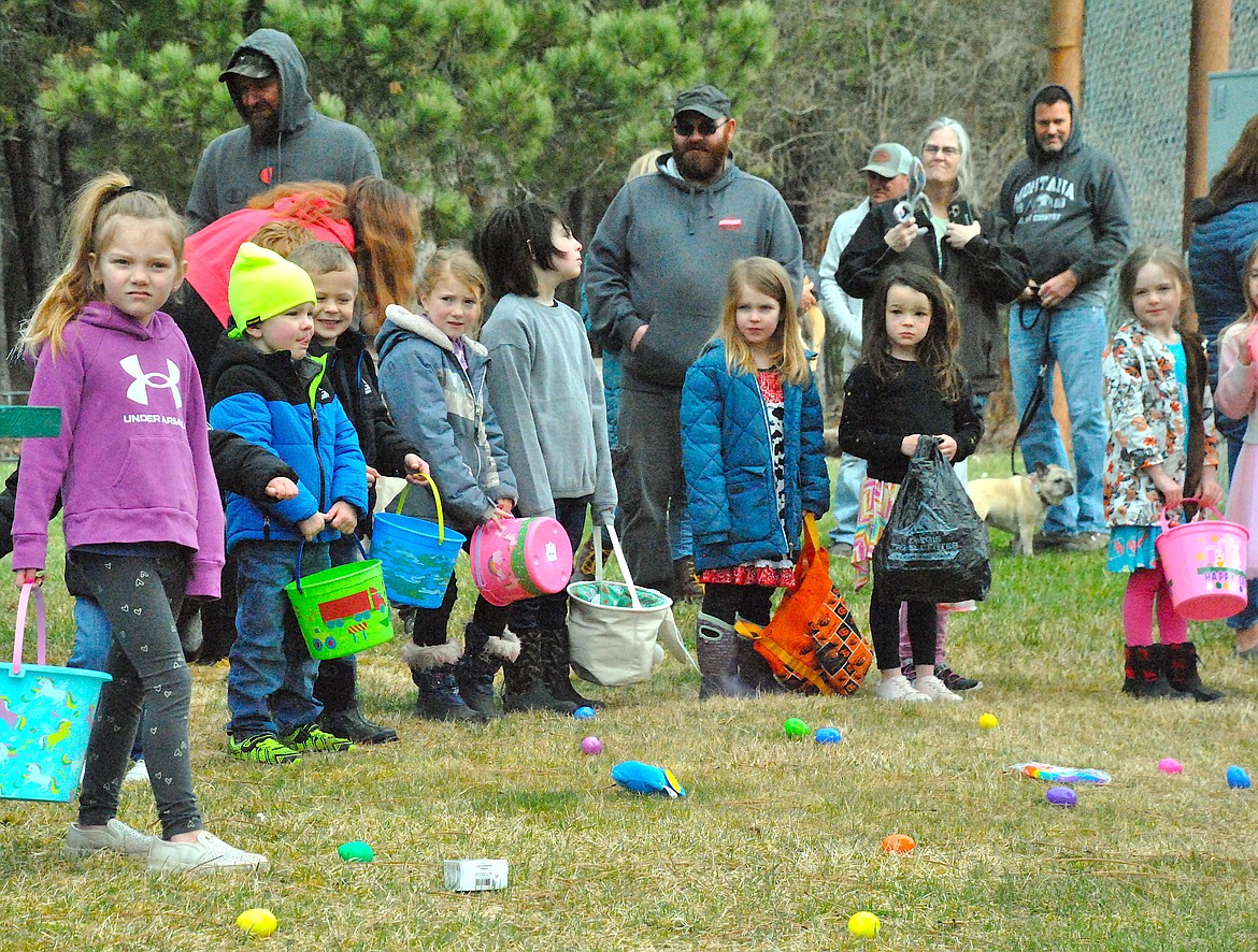 The 4 to 6-year-olds wait anxiously at the perimeter of their egg hunt zone with colorful baskets at hand during the St. Regis Easter Egg Hunt at the Community Park on Saturday morning. (Mineral Independent/Amy Quinlivan)